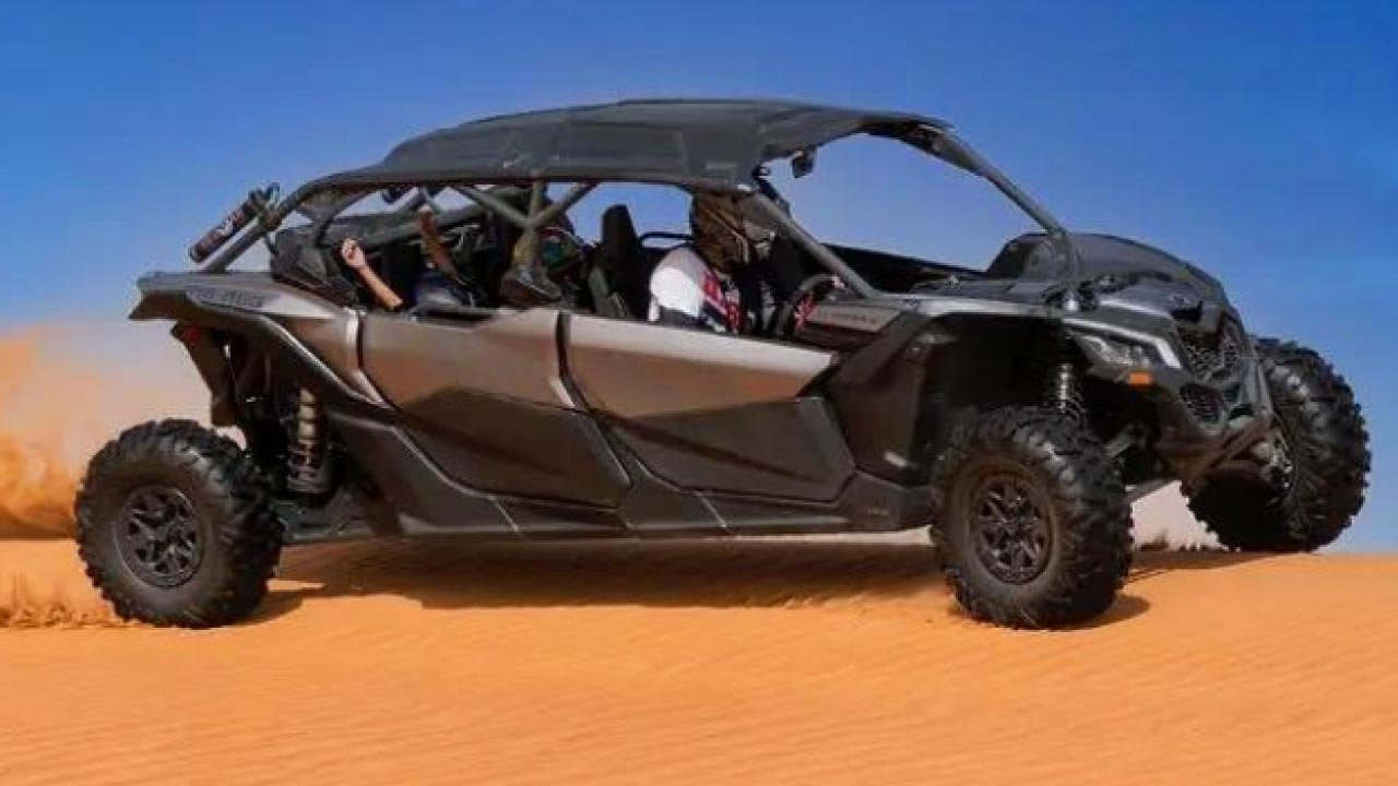 Guided Can-Am Maverick X3 buggy tour across Dubai desert sand dunes